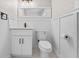 Modern bathroom with white vanity, black hardware, and decorative wainscoting at 50 Community Dr, Debary, FL 32713