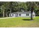 Well-manicured lawn surrounds this cozy home, creating an inviting curb appeal and a lovely outdoor space at 50 Community Dr, Debary, FL 32713
