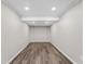 Modern room with wood-look flooring, neutral paint, and recessed lighting at 50 Community Dr, Debary, FL 32713