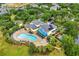 Aerial shot of community amenities, featuring a pool, hot tub, and clubhouse at 510 Rum Run # 33 510, Davenport, FL 33837