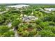 Aerial shot showcasing the clubhouse, lake, manicured landscaping, and community swimming pool at 510 Rum Run # 33 510, Davenport, FL 33837