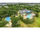 Aerial view showcasing the community pool, clubhouse, and beautifully landscaped grounds at 510 Rum Run # 33 510, Davenport, FL 33837