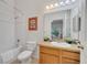 Well-lit bathroom featuring a shower-tub combination, single sink vanity, and neutral tile flooring at 510 Rum Run # 33 510, Davenport, FL 33837