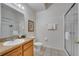 Bathroom with a single sink vanity and glass-enclosed shower, featuring clean and functional space at 510 Rum Run # 33 510, Davenport, FL 33837