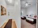 Hallway view into the bedroom with 2 beds, ceiling fan, and playful decor, creating a fun, inviting space at 510 Rum Run # 33 510, Davenport, FL 33837