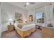 Bright bedroom with a queen bed, wicker furniture, ceiling fan, and a window with natural light at 510 Rum Run # 33 510, Davenport, FL 33837