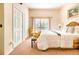 Cozy bedroom with a queen-size bed, a private balcony and neutral decor at 510 Rum Run # 33 510, Davenport, FL 33837