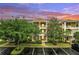 Inviting exterior featuring multi-level balconies, manicured landscaping, and convenient parking at 510 Rum Run # 33 510, Davenport, FL 33837