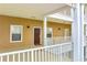 Exterior view features a covered entryway, multiple windows, and a brown front door with welcome mat at 510 Rum Run # 33 510, Davenport, FL 33837