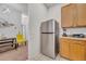 Efficient kitchen featuring stainless steel appliances, breakfast bar, and seamless connectivity to the adjacent dining area at 510 Rum Run # 33 510, Davenport, FL 33837