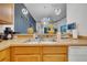 Well-equipped kitchen with stainless steel sink, modern faucet, and open view to the dining and living areas at 510 Rum Run # 33 510, Davenport, FL 33837