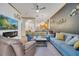 Inviting living room with stylish decor, comfortable seating, and a cozy atmosphere with ceiling fan and entertainment center at 510 Rum Run # 33 510, Davenport, FL 33837