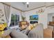 Cozy living room featuring comfortable seating, decorative accents, and a balcony view at 510 Rum Run # 33 510, Davenport, FL 33837