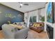 Bright living room with comfortable seating, stylish decor, and access to a private balcony with plenty of natural light at 510 Rum Run # 33 510, Davenport, FL 33837