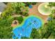 A colorful splash pad with palm tree features and water features, all surrounded by lush greenery and trees at 510 Rum Run # 33 510, Davenport, FL 33837