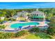 Stunning aerial view showcasing a large community pool with seating and amenities at 510 Rum Run # 33 510, Davenport, FL 33837
