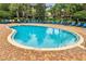 This pool offers an inviting space with a smooth entry, complemented by surrounding lounge chairs for ultimate relaxation at 510 Rum Run # 33 510, Davenport, FL 33837