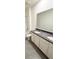 Modern bathroom featuring dual vanities with granite countertops at 5168 Greenheart Ave, Mount Dora, FL 32757