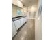 Bathroom featuring a double vanity, shower, large mirror, and tiled floors at 5168 Greenheart Ave, Mount Dora, FL 32757