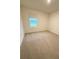 Bedroom with carpeted floors, neutral paint, and bright natural light at 5168 Greenheart Ave, Mount Dora, FL 32757