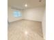 Empty bedroom with carpeted floor, window with blinds, and neutral paint at 5216 Greenheart Ave, Mount Dora, FL 32757