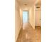 Hallway with tile floors leads to bright rooms with neutral paint, doors, and windows at 5216 Greenheart Ave, Mount Dora, FL 32757
