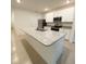 Bright kitchen features granite counters, stainless steel appliances, and tiled floors at 5216 Greenheart Ave, Mount Dora, FL 32757