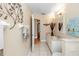 Well-lit bathroom features double sinks, tile flooring, and decorative wall art at 603 Yorkshire Dr, Oviedo, FL 32765