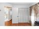 This bedroom features a spacious closet and adjacent access to a well-lit bathroom at 603 Yorkshire Dr, Oviedo, FL 32765