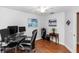 A bedroom features wood flooring, neutral walls, and a ceiling fan at 603 Yorkshire Dr, Oviedo, FL 32765