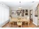 Cozy dining room featuring classic decor, hardwood floors, neutral walls, and a stylish chandelier at 603 Yorkshire Dr, Oviedo, FL 32765