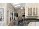 Well-lit kitchen featuring granite countertops, ample storage, and views to the sitting area with hardwood floors at 603 Yorkshire Dr, Oviedo, FL 32765
