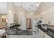Functional kitchen with granite countertops, white cabinetry, and modern appliances; seamless workflow at 603 Yorkshire Dr, Oviedo, FL 32765