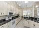 Bright kitchen with granite countertops, modern appliances, and lots of cabinet space at 603 Yorkshire Dr, Oviedo, FL 32765