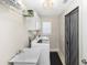 Laundry room featuring a utility sink, washer, dryer, and a wire storage rack at 603 Yorkshire Dr, Oviedo, FL 32765