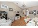Spacious living room featuring vaulted ceilings, neutral walls, hardwood floors, and an elegant chandelier at 603 Yorkshire Dr, Oviedo, FL 32765