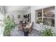Inviting sunroom features tile flooring, comfortable seating, and lots of natural light at 603 Yorkshire Dr, Oviedo, FL 32765