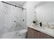 Stylish bathroom features a glass-enclosed shower, modern vanity, and elegant marble accents at 6454 Chorus Dr, Mascotte, FL 34753