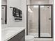 Beautiful bathroom featuring a glass shower with dark trim, and modern tiling and fixtures at 6678 Juneberry Way, Winter Garden, FL 34787