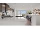 Bright, modern kitchen with quartz countertops and a breakfast nook that overlooks outdoor scenery at 6678 Juneberry Way, Winter Garden, FL 34787