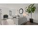 Bright living room features modern decor, large windows, and plush seating at 6678 Juneberry Way, Winter Garden, FL 34787