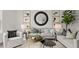 Stylish living room with comfortable seating, modern decor, and ample natural light at 6678 Juneberry Way, Winter Garden, FL 34787