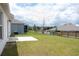 The backyard features a well-kept lawn, offering a serene outdoor space at 707 Staffora St, Haines City, FL 33844