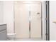 Bathroom featuring a shower with sliding glass doors, along with a toilet at 707 Staffora St, Haines City, FL 33844
