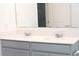 Bathroom featuring a double sink vanity with modern fixtures at 707 Staffora St, Haines City, FL 33844