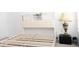 Bedroom featuring a bed frame with a built-in headboard with a lamp on the bedside table at 707 Staffora St, Haines City, FL 33844