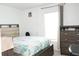 Bedroom featuring a bed, a dresser and a bright window at 707 Staffora St, Haines City, FL 33844
