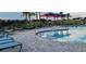 Inviting community pool with ample seating and shaded areas at 707 Staffora St, Haines City, FL 33844