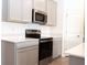 Kitchen featuring stainless steel appliances, ample counter space, and sleek cabinetry at 707 Staffora St, Haines City, FL 33844