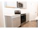 Kitchen featuring stainless steel appliances, ample counter space, and sleek cabinetry at 707 Staffora St, Haines City, FL 33844